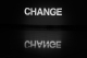 Black background with white letters spelling the word change.