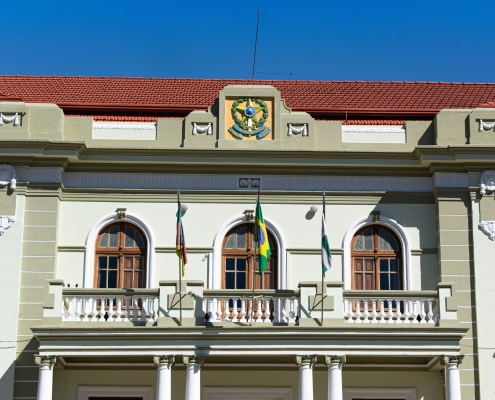 two-story building with balcony and Brazil flag hanging from it; Brazil - a changing energy market